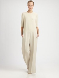 This silky, wide-legged one-piece silhouette has an elegant, fluid sensibility.Jewel necklineElbow-length sleevesFront welt pocketSide slash pocketsConcealed back zipInseam, about 3089% wool/9% cotton/2% polyesterDry cleanMade in Italy of imported fabricModel shown is 5'11 (180cm) wearing US size 4. This silky, wide-legged one-piece silhouette has an elegant, fluid sensibility.Jewel necklineElbow-length sleevesFront welt pocketSide slash pocketsConcealed back zipInseam, about 3089% wool/9% cotton/2% polyesterDry cleanMade in Italy of imported fabricModel shown is 5'11 (180cm) wearing US size 4.