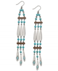 A tribal-inspired style guaranteed to turn a few heads. These worn silver tone earrings from Lauren by Ralph Lauren feature reconstituted turquoise beads and a chic linear drop design. Approximate drop: 5-1/2 inches. A tribal-inspired style guaranteed to turn a few heads. These worn silver tone earrings from Lauren by Ralph Lauren feature reconstituted turquoise beads and a chic linear drop design. Approximate drop: 5-1/2 inches.