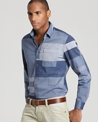 The bold, printed-denim block pattern of this slim-fitting Elie Tahari button-down shirt makes a striking statement anywhere you go. The bold, printed-denim block pattern of this slim-fitting Elie Tahari button-down shirt makes a striking statement anywhere you go.