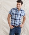 Size matters. This slim fit shirt from Tommy Hilfiger accents your trim look for summer.