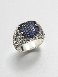 A cluster of pave sapphires set in finely detailed sterling silver.Sterling silverSapphiresAbout .75 diameterImported