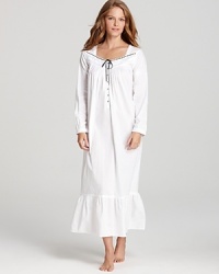 Fit for a queen, this beautiful Eileen West nightgown features a ruffle hem, floral applique neckline and contrast ribbon tie. Fit for a queen, this beautiful Eileen West nightgown features a ruffle hem, floral applique neckline and contrast ribbon tie.