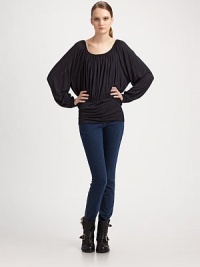 Fluid, shirred scoopneck with dramatic bell sleeves and an elastic waistband. Scoopneck Long bell sleeves Elastic waistband Back button keyhole closure Viscose Machine wash Imported Fluid, shirred scoopneck with dramatic bell sleeves and an elastic waistband. Scoopneck Long bell sleeves Elastic waistband Back button keyhole closure Viscose Machine wash Imported