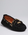 Edgy spikes and classic tassels work together, in bold gold, to make these Sam Edelman moccasin flats shine.