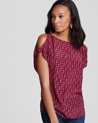 Articulated in floral-print silk, this Joie top features cutout shoulders for a subtle hint of skin. Articulated in floral-print silk, this Joie top features cutout shoulders for a subtle hint of skin.