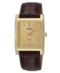 Casual cool and solar heat move this handsome Seiko watch. Crafted of croc-embossed brown leather strap and rectangular gold-tone stainless steel case. Champagne dial with applied stick indices at markers, hour and minute hands, and logo at twelve o'clock. Solar-powered quartz movement. Water resistant to 30 meters. Three-year limited warranty. Casual cool and solar heat move this handsome Seiko watch. Crafted of croc-embossed brown leather strap and rectangular gold-tone stainless steel case. Champagne dial with applied stick indices at markers, hour and minute hands, and logo at twelve o'clock. Solar-powered quartz movement. Water resistant to 30 meters. Three-year limited warranty.