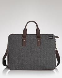 Blending classic mid-century style with utterly modern functionality, this retro-sophisticated accordion briefcase features a subtly masculine wool herringbone motif accented with smooth leather and metal hardware. Blending classic mid-century style with utterly modern functionality, this retro-sophisticated accordion briefcase features a subtly masculine wool herringbone motif accented with smooth leather and metal hardware.
