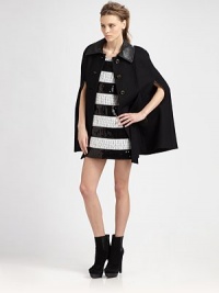 Wool-rich statement piece has leather trim, a plethora of pockets and waist-cinching self tie. Leather point collarCape sleevesButton frontFront self tieDual flap pockets; besom pocketsFully linedAbout 30 from shoulder to hem65% wool/35% viscoseDry cleanImportedModel shown is 5'10 (177cm) wearing US size 4. Wool-rich statement piece has leather trim, a plethora of pockets and waist-cinching self tie. Leather point collarCape sleevesButton frontFront self tieDual flap pockets; besom pocketsFully linedAbout 30 from shoulder to hem65% wool/35% viscoseDry cleanImportedModel shown is 5'10 (177cm) wearing US size 4.