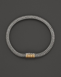 John Hardy sterling silver and gold bracelet with single station.