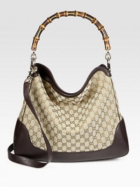 Proven to play into its feminine charm, the Diana shoulder bag continues to make a lasting impression. Original GG canvasLeather trimLight fine gold hardwareBamboo handle, 6.5 dropAdjustable and detachable shoulder strap, 19 dropOverlapping open topSpur hardwareInterior zip and smart phone pocketsNatural cotton linen liningMedium size: 15.7W x 11.8H x 3.9DMade in Italy Proven to play into its feminine charm, the Diana shoulder bag continues to make a lasting impression. Original GG canvasLeather trimLight fine gold hardwareBamboo handle, 6.5 dropAdjustable and detachable shoulder strap, 19 dropOverlapping open topSpur hardwareInterior zip and smart phone pocketsNatural cotton linen liningMedium size: 15.7W x 11.8H x 3.9DMade in Italy