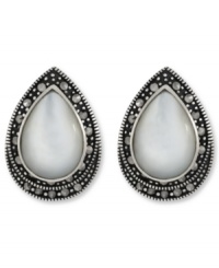Shimmer and shine. Genevieve & Grace's pretty button stud earrings feature a Mother of Pearl center surrounded by glittering marcasite. Set in sterling silver. Earrings feature an omega clip-on backing for non-pierced ears. Approximate length: 7/8 inch. Approximate width: 5/8 inch. Shimmer and shine. Genevieve & Grace's pretty button stud earrings feature a Mother of Pearl center surrounded by glittering marcasite. Set in sterling silver. Earrings feature an omega clip-on backing for non-pierced ears. Approximate length: 7/8 inch. Approximate width: 5/8 inch.