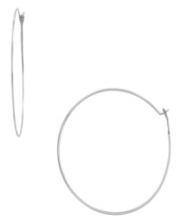 Simple, subtle, and always stylish. Add a little urban-chic style to your look in Michael Kors slim hoop earrings. Crafted in silver tone mixed metal. Approximate diameter: 2-1/4 inches. Simple, subtle, and always stylish. Add a little urban-chic style to your look in Michael Kors slim hoop earrings. Crafted in silver tone mixed metal. Approximate diameter: 2-1/4 inches.