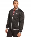 Keep your sporty style doing double time with this reversible jacket from Nike.