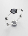 From the Wonderland Collection. Round faceted hematite doublet stations in various sizes set on a hammered sterling silver bangle. Hematite doubletSterling silverDiameter, about 2.5Slip-on styleImported 