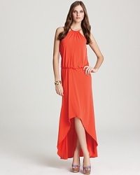 A gold-tone halter neck lends glamour to this vibrantly hued Laundry by Shelli Segal Gown, finished with a striking high/low hem. A gold-tone halter neck lends glamour to this vibrantly hued Laundry by Shelli Segal Gown, finished with a striking high/low hem.