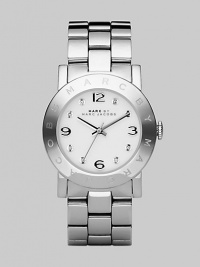 Stainless steel case and bracelet with a polished finish and clear stone hour markers.Quartz movement Water resistant to 3 ATM Stainless steel bezel with engraved logo Round case, 36mm, (1.43) White dial Numeral and clear stone hour makers Second hand Stainless steel bracelet, 20mm, (.79) Imported Stainless steel case and bracelet with a polished finish and clear stone hour markers.Quartz movement Water resistant to 3 ATM Stainless steel bezel with engraved logo Round case, 36mm, (1.43) White dial Numeral and clear stone hour makers Second hand Stainless steel bracelet, 20mm, (.79) Imported