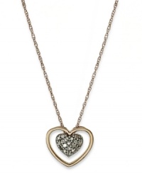 A romantic accent. This chic cut-out heart pendant is covered with round-cut diamonds (1/10 ct. t.w.) and crafted in 14k rose gold. Approximate length: 18 inches. Approximate drop: 1/3 inch.