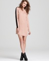 Tuxedo stripes dress up this 10 Crosby Derek Lam silk tunic style for a modern take on classic chic.