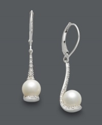 Scoop up glamorous style in seconds! These glamorous, spoon-shaped drop earrings highlight a cultured freshwater pearl (7 mm) and sparkling, round-cut diamonds (1/10 ct. t.w.). Crafted in sterling silver. Approximate drop: 1/2 inch. Scoop up glamorous style in seconds! These glamorous, spoon-shaped drop earrings highlight a cultured freshwater pearl (7 mm) and sparkling, round-cut diamonds (1/10 ct. t.w.). Crafted in sterling silver. Approximate drop: 1/2 inch.