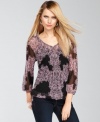 INC updates a soft peasant top silhouette with bold color and a paisley print for an appealing anytime casual look.
