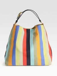 Roomy top-handle carryall crafted from vibrant canvas with rich leather trim.Adjustable top handle, 6-6½ dropTop snap closureOne inside zip pocketLinen/suede lining14¾W X 13H X 7DMade in ItalyPlease note: color and pattern may vary Roomy top-handle carryall crafted from vibrant canvas with rich leather trim.Adjustable top handle, 6-6½ dropTop snap closureOne inside zip pocketLinen/suede lining14¾W X 13H X 7DMade in ItalyPlease note: color and pattern may vary