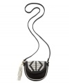 An indie-chic design with tribal-inspired accents. This Danielle Nicole crossbody will take your style to a whole new level with a whip stitch detailed flap, contrast tassels and a go-anywhere silhouette.