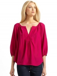 THE LOOKNotched V neckline¾ sleeves with elastic cuffsShirttail hemTHE FITAbout 22 from shoulder to hemTHE MATERIALSilkCARE & ORIGINDry cleanMade in USA THE LOOKNotched V neckline¾ sleeves with elastic cuffsShirttail hemTHE FITAbout 22 from shoulder to hemTHE MATERIALSilkCARE & ORIGINDry cleanMade in USA