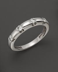 Diamonds dot a 14K white gold band. Diamonds dot a 14K white gold band.