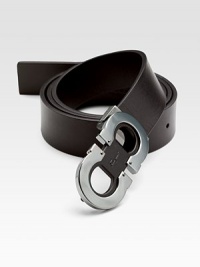 A dark ruthenium double gancini buckle highlights the front of this gorgeous calfskin design.LeatherRuthenium buckleAbout 1¼ wideMade in Italy A dark ruthenium double gancini buckle highlights the front of this gorgeous calfskin design.LeatherRuthenium buckleAbout 1¼ wideMade in Italy
