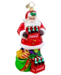 Santa Claus pops open the perfect gift – two six packs of Coca-Cola for delicious and refreshing holidays. With brilliant detail, from the holly in his hat to the bells on his bag, it's an essential ornament for Christopher Radko collectors. Santa Claus pops open the perfect gift – two six packs of Coca-Cola for delicious and refreshing holidays. With brilliant detail, from the holly in his hat to the bells on his bag, it's an essential ornament for Christopher Radko collectors.