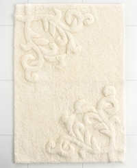 Featuring one of the most elegant designs from Lenox, this Opal Innocence bath rug creates a refined look for your bathroom. Crafted with a beautiful design of scrolling vines, this tufted and carved cotton rug carries with it exceptional style and grace. Featuring one of the most elegant designs from Lenox, this Opal Innocence bath rug creates a refined look for your bathroom. Crafted with a beautiful design of scrolling vines, this tufted and carved cotton rug carries with it exceptional style and grace.