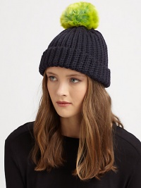 A cozy knit topper with a bold pom-pom for a simple, yet stylish, accessory.7 longMerino woolHand washImported