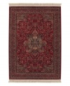 The Couristan Kashimar area rug is inspired by classic Oriental and Persian motifs, featuring a richly detailed design in warm red with grey florals. With features like 100% New Zealand semi-worsted wool, Couristan's exclusive locked in weave, crystal-point finish and hand-knotted fringes, the Medallion Antique Red rug offers a sophisticated addition to any room of your home.