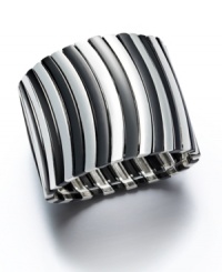 Bold design for the stylish woman. Alfani's wavy stretch cuff bracelet slips over the wrist and adds instant dimension to your wardrobe. Crafted in silver tone and hematite tone mixed metal. Approximate length: 7-1/2 inches. Approximate diameter: 2-1/2 inches. Bold design for the stylish woman. Alfani's wavy stretch cuff bracelet slips over the wrist and adds instant dimension to your wardrobe. Crafted in silver tone and hematite tone mixed metal. Approximate length: 7-1/2 inches. Approximate diameter: 2-1/2 inches.