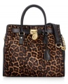 MICHAEL Michael Kors gives a classic tote design an edgy upgrade with leopard print haircalf, stud accents and signature hardware. But don't let this silhouette's luxe look fool you: it's roomy, pocket-trimmed interior perfects practical style.