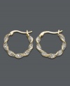 Simple hoops with a sparkling twist. Earrings by Victoria Townsend are crafted in 18k gold over sterling silver with round-cut diamond accents and a unique twisted design. Approximate diameter: 3/4 inch.
