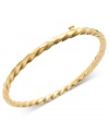 Polished design for the tiny fashionista. This chic bangle for children features a smooth, twisted design in 14k gold. Approximate diameter: 2 inches.