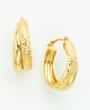 Textured details and a high-polish finish make these classic hoop earrings anything but ordinary. Set in 14k gold.