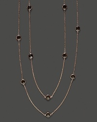 Eighteen bezel set smoky quartz stations sparkle in a long, loopable 14K rose gold chain. Eighteen bezel set smoky quartz stations sparkle in a long, loopable 14K rose gold chain.