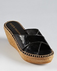 A silhouette that's easy to slip on and go, Andre Assous' Ashlee slides boast a carefree look in patent leather. A silhouette that's easy to slip on and go, Andre Assous' Ashlee slides boast a carefree look in patent leather.