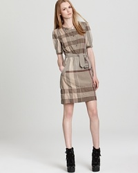 Stop traffic from commute to corner office in this Burberry Brit dress emblazoned by an oversized checked print for modern elegance. Stop traffic from commute to corner office in this Burberry Brit dress emblazoned by an oversized checked print for modern elegance.