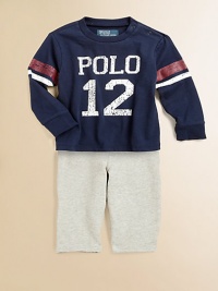 A sporty set pairs an essential fleece pant and an athletic cotton jersey tee with a faded graphic print. Tee CrewneckLong sleevesShoulder snaps Pants Front button closureRear elasticized waistbandFaux flyOn-seam pockets87% cotton/13% polyesterMachine washImported Please note: Number of snaps may vary depending on size ordered. A sporty set pairs an essential fleece pant and an athletic cotton jersey tee with a faded graphic print. Tee CrewneckLong sleevesShoulder snaps Pants Front button closureRear elasticized waistbandFaux flyOn-seam pockets87% cotton/13% polyesterMachine washImported Please note: Number of snaps may vary depending on size ordered.