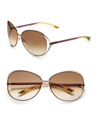 Round modified metal frames with open-end lens and tubular temples. Available in shiny rose gold with brown gradient lens.100% UV protection Made in Italy Round modified metal frames with open-end lens and tubular temples. Available in shiny rose gold with brown gradient lens.100% UV protection Made in Italy