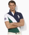 Designed exclusively for Ralph Lauren's collection celebrating the Wimbledon Championships, a classic short-sleeved polo shirt is tailored for a trim, modern fit from breathable cotton mesh in a preppy color-blocked design.