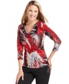 Embolden any ensemble with JM Collection's printed cowl-neck top.