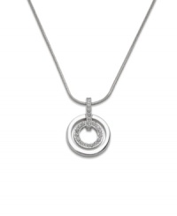These chic circles provide the perfect element of style and sparkle to your look. Swarovski pendant features two cut-out circles. Crafted in silver tone mixed metal with glittering crystal accents. Approximate length: 16-1/2 inches. Approximate drop: 1 inch. These chic circles provide the perfect element of style and sparkle to your look. Swarovski pendant features two cut-out circles. Crafted in silver tone mixed metal with glittering crystal accents. Approximate length: 16-1/2 inches. Approximate drop: 1 inch.