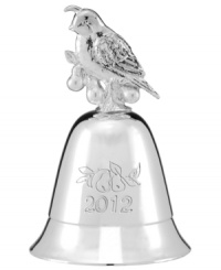 Give it a ring. Engraved for 2012, this silver Lenox bell is topped with a partridge and pears and plays The Twelve Days of Christmas. Give it a ring. Engraved for 2012, this silver Lenox bell is topped with a partridge and pears and plays The Twelve Days of Christmas.