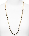 kate spade new york styles scattered simplicity with this long-link necklace, cast in 12 karat gold plate and accented by a smattering of bold stones.