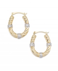 Notched accents give these hoop earrings a segmented look. Set in 14k white and yellow gold. Notched accents give these hoop earrings a segmented look. Set in 14k white and yellow gold.