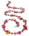 Infuse your look with fiery-hot hues. Style&co.'s lively, long necklace combines orange and fuchsia-colored shells with subtle wooden beads for a look that's naturally appealing. Set in oxidized brass tone mixed metal. Approximate length: 42-1/2 inches.